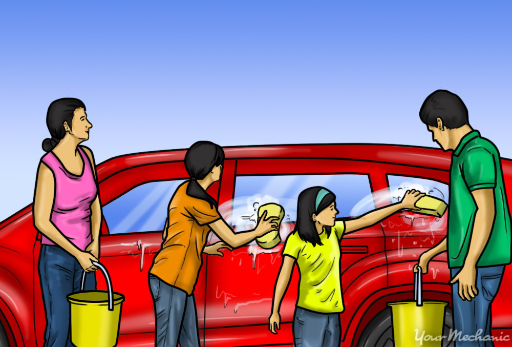 family washing car