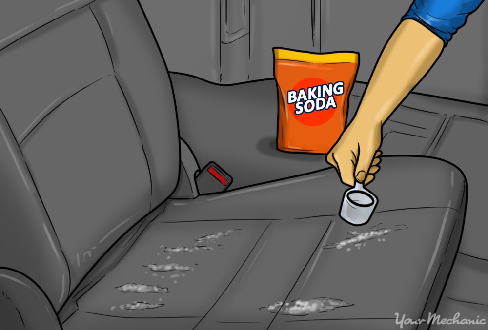 baking soda being applied to a car seat