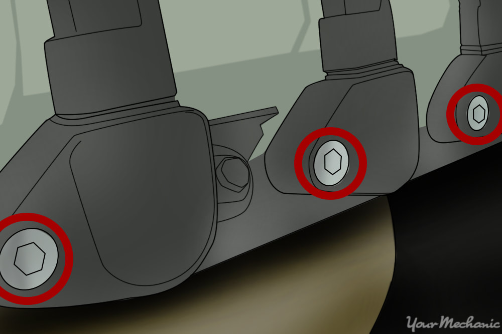 retaining bolts or screws holding the ignition coil in place as well as electrical connectors