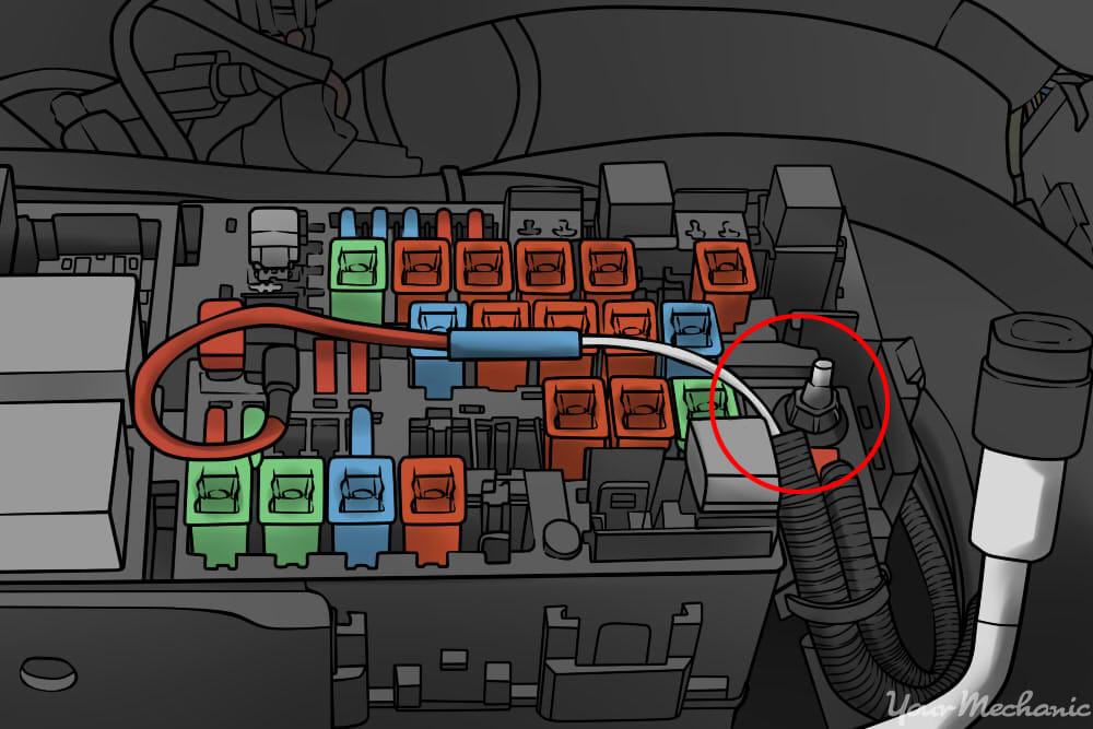 ground wire attached to bolt next to fuse box