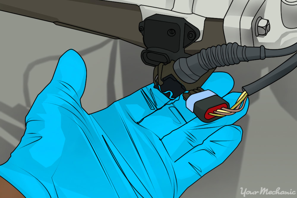 hand disconnecting the electrical connectors from the air intake