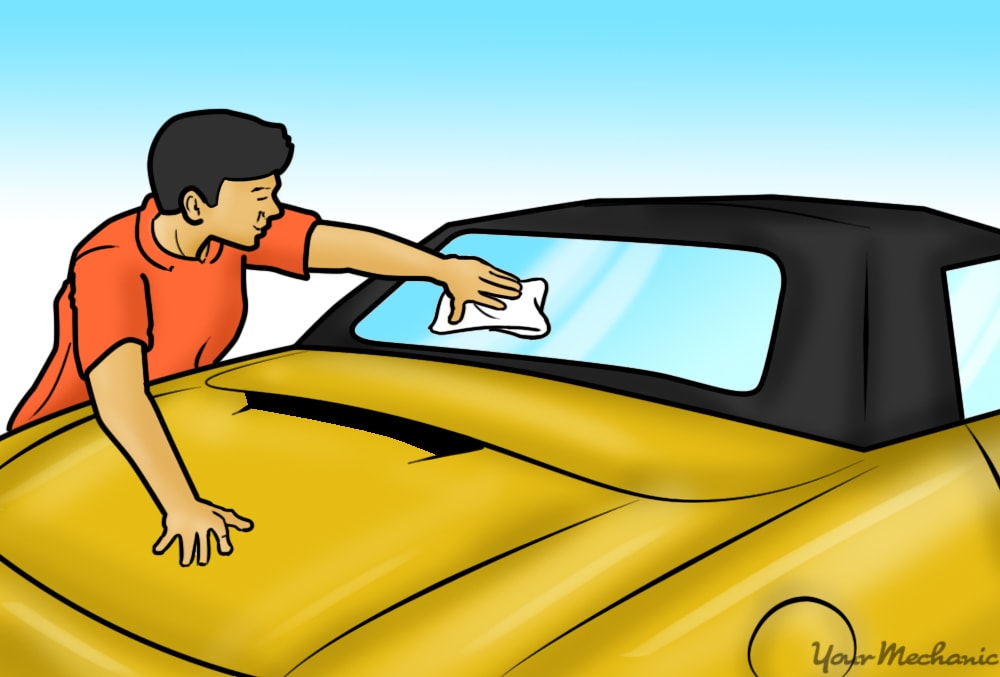 person cleaning of the rear window