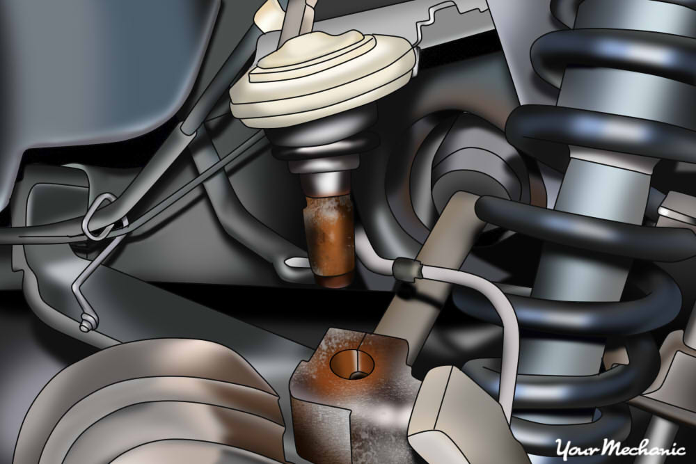 upper control arm ball joint being removed from pinch bracket of spindle