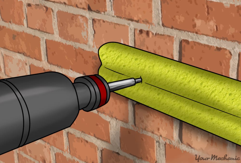 screwdriver screwing noodle onto wall