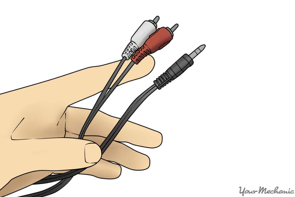 hand holding audio cables