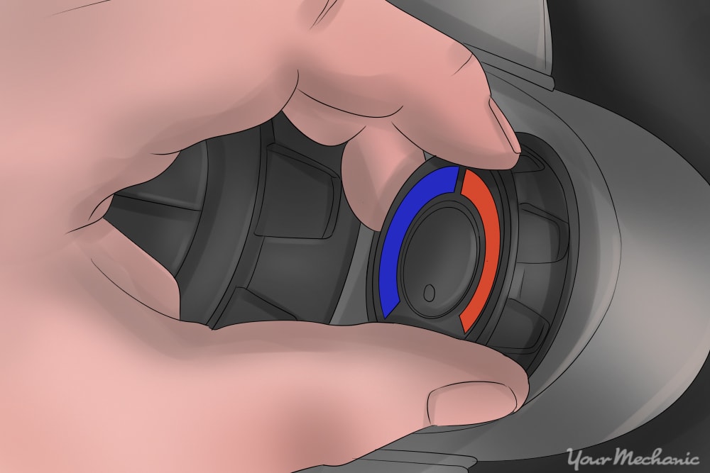 hand adjusting dial from blue to red