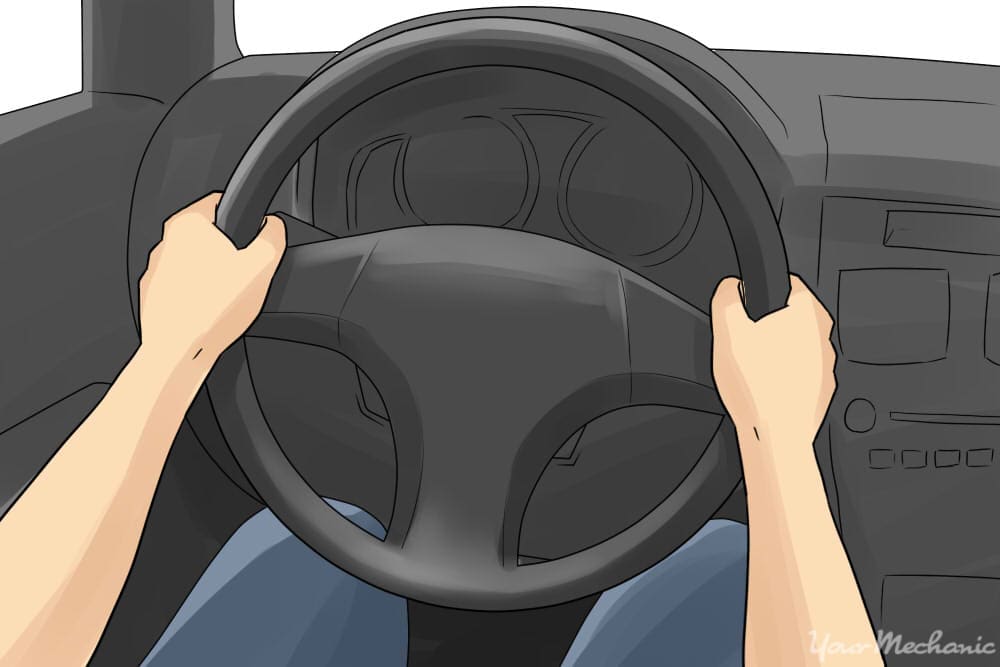 hands in 9-3 position on steering wheel