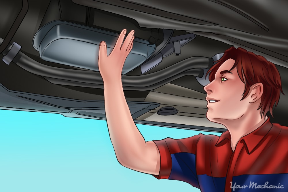 mechanic checking transmission fluid and filter