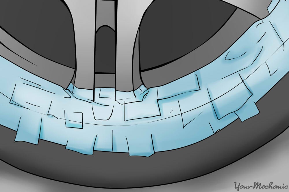 applying masking tape to rim