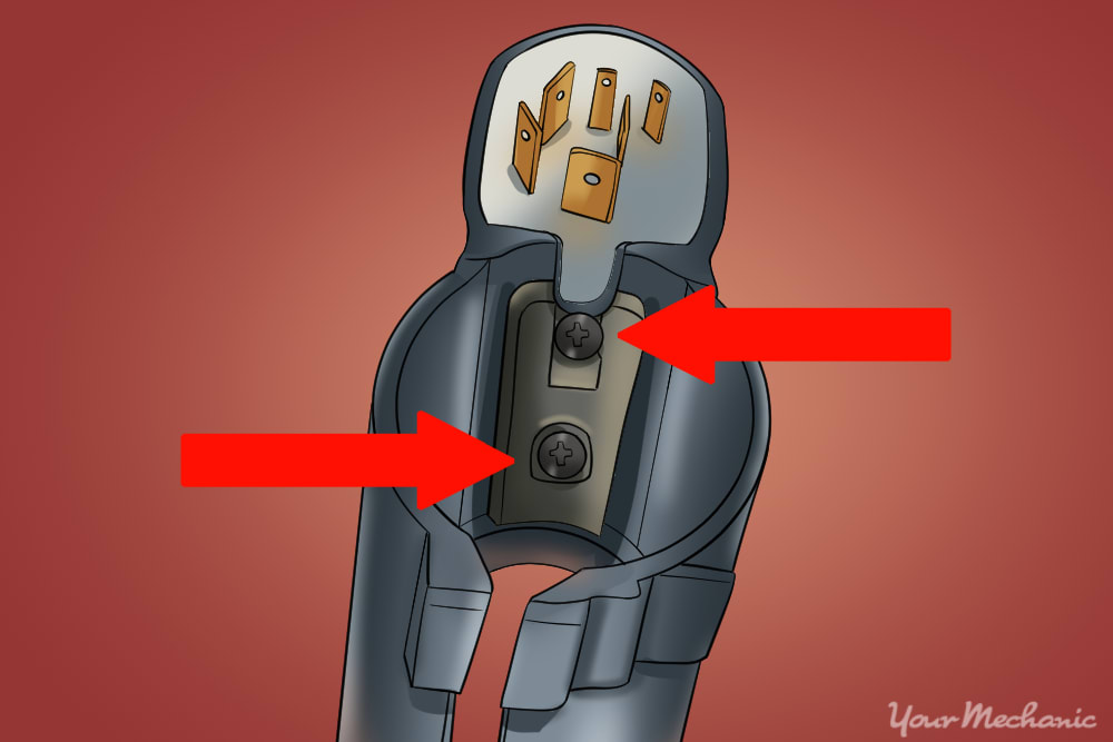 location of the two screws on top of the ignition lock body