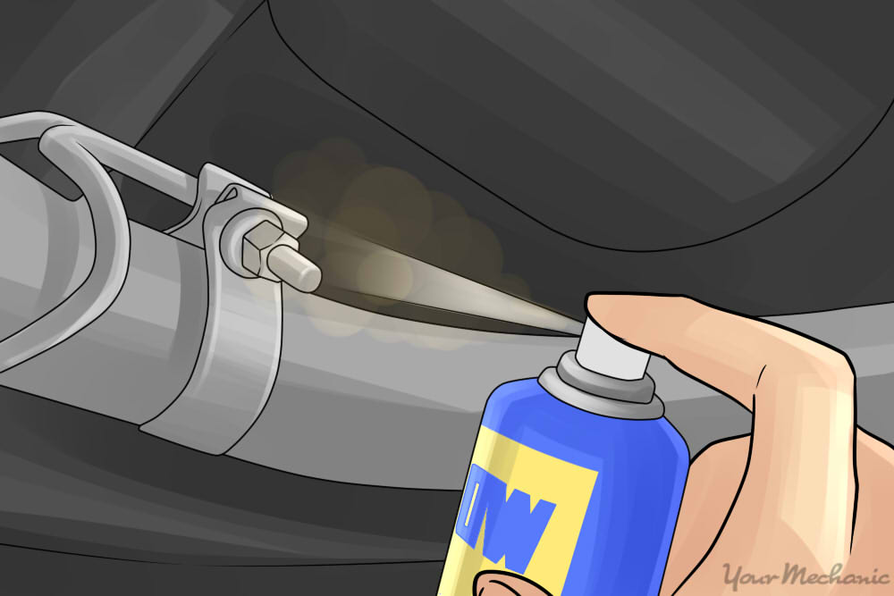 wd-40 being sprayed on an exhaust clamp