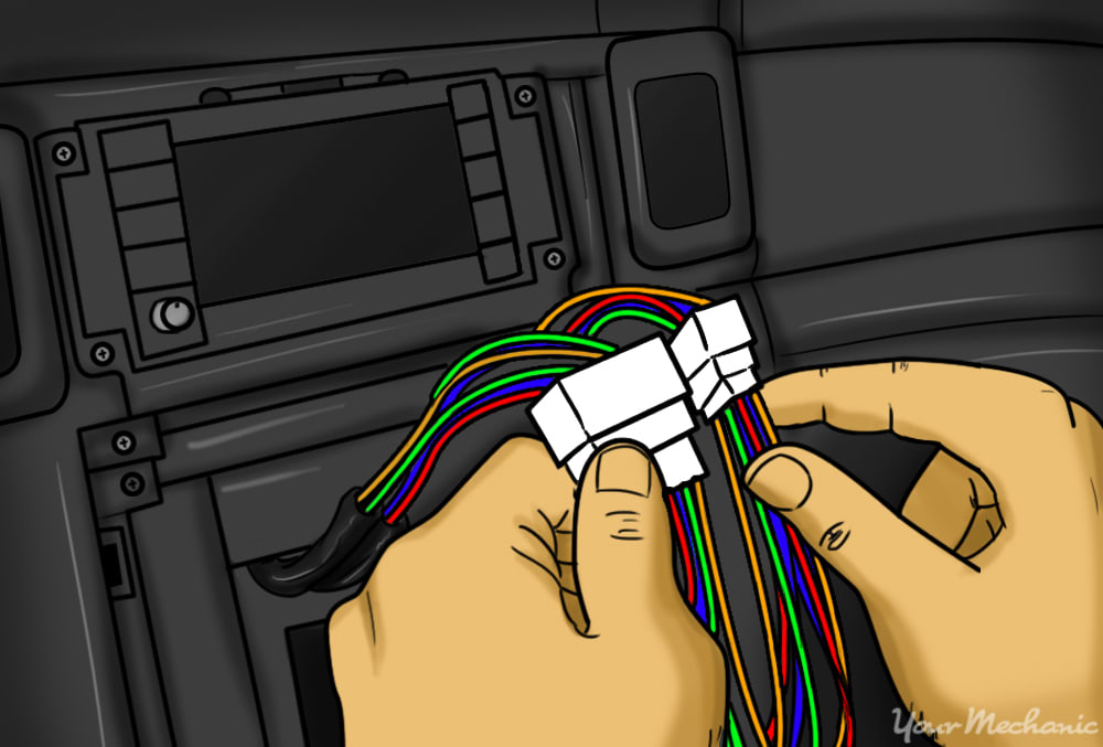 person connecting the original stereo connectors from the car to the ends of new spliced wiring harness