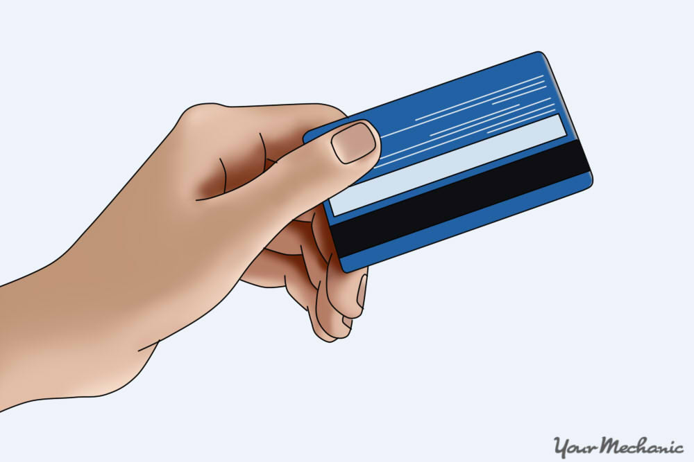 hand holding a credit card