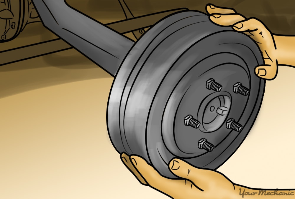 person rotating the brake drum