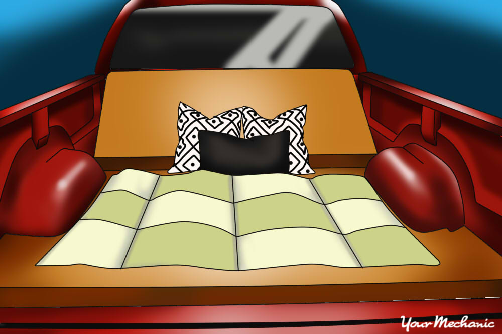 couch dressed with a blanket and pillows