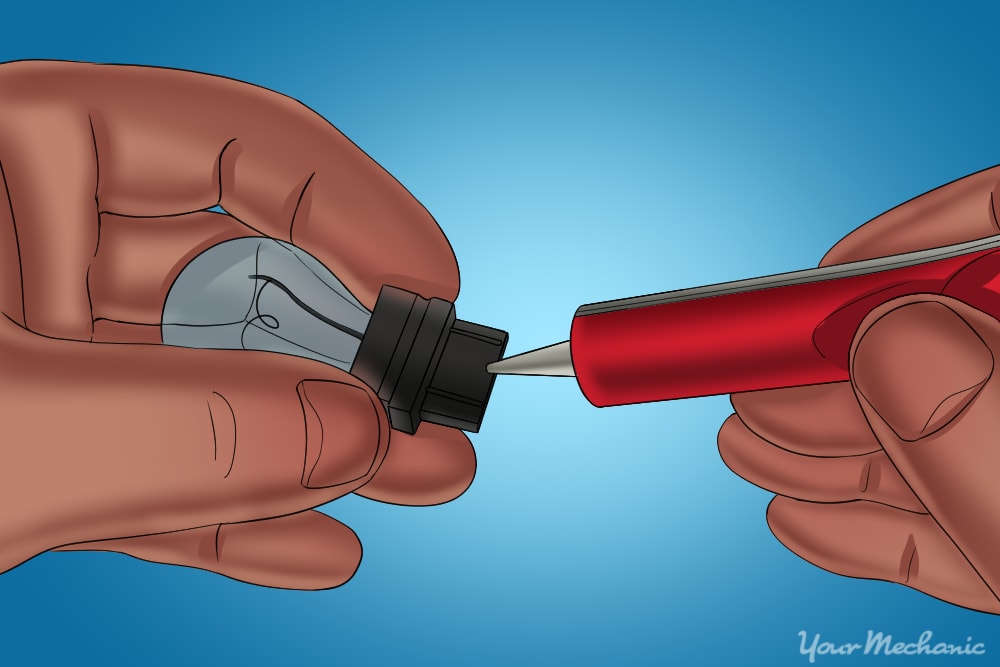 applying dielectric grease to brake light socket