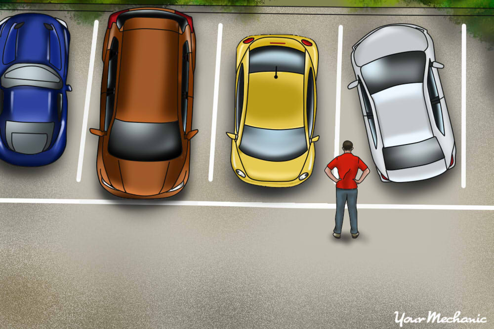 person checking the space in between cars