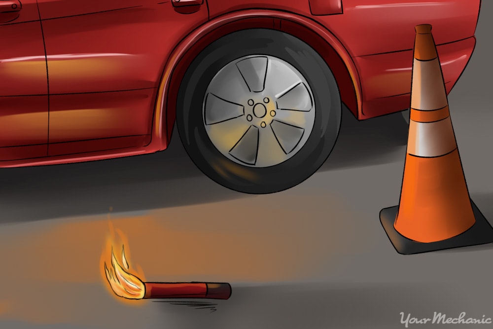 路耀斑和交通锥附近停着的车