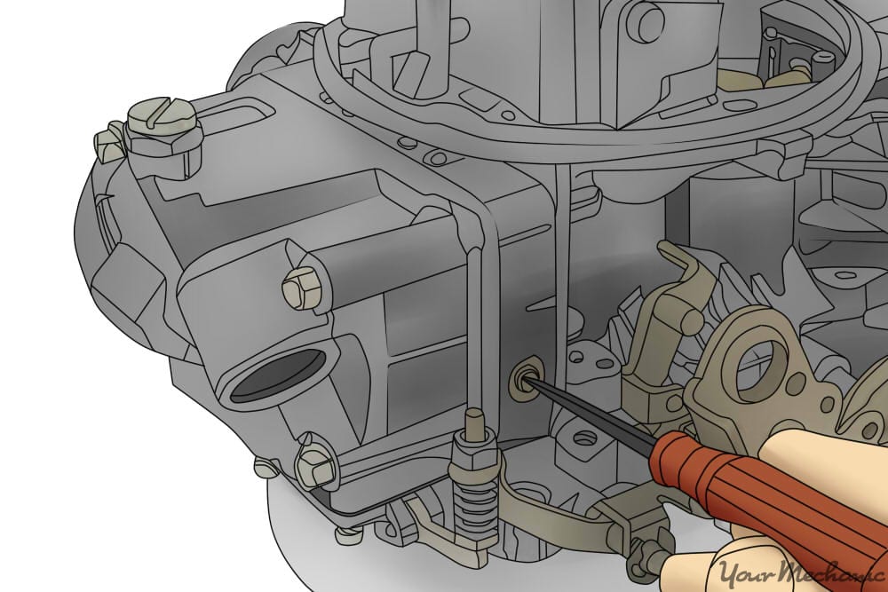 person adjusting idle mixture screw