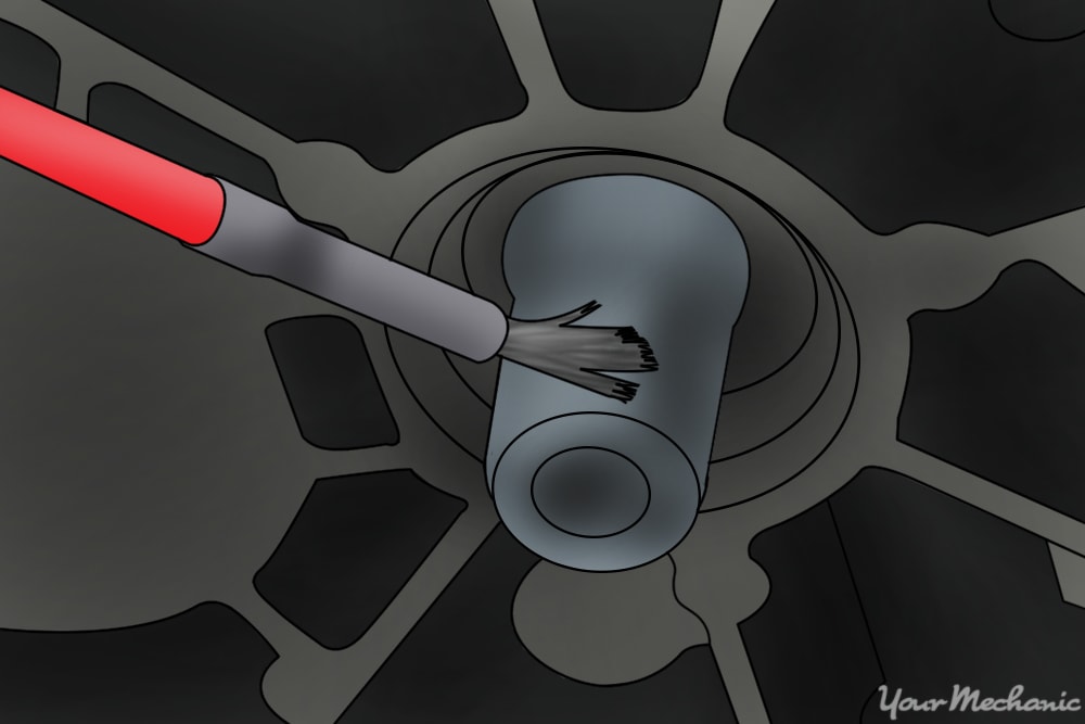 brush appling grease to a spline