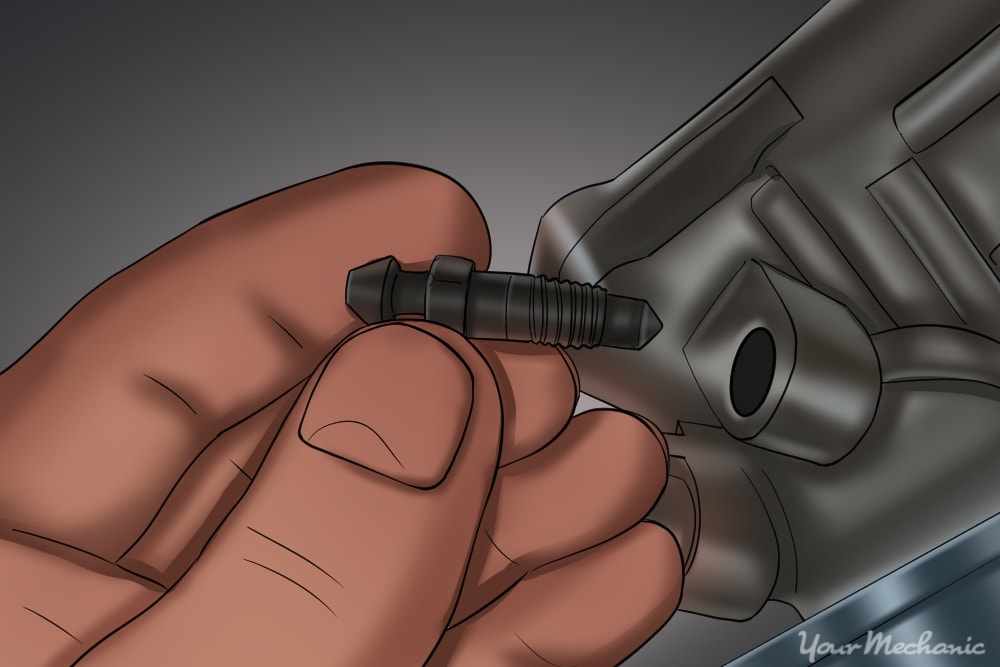 bleeder screw being removed