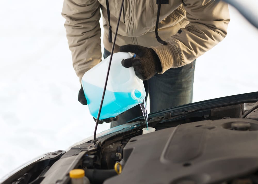 De-icing for uncovered parking. Windshield wiper fluid in a spray