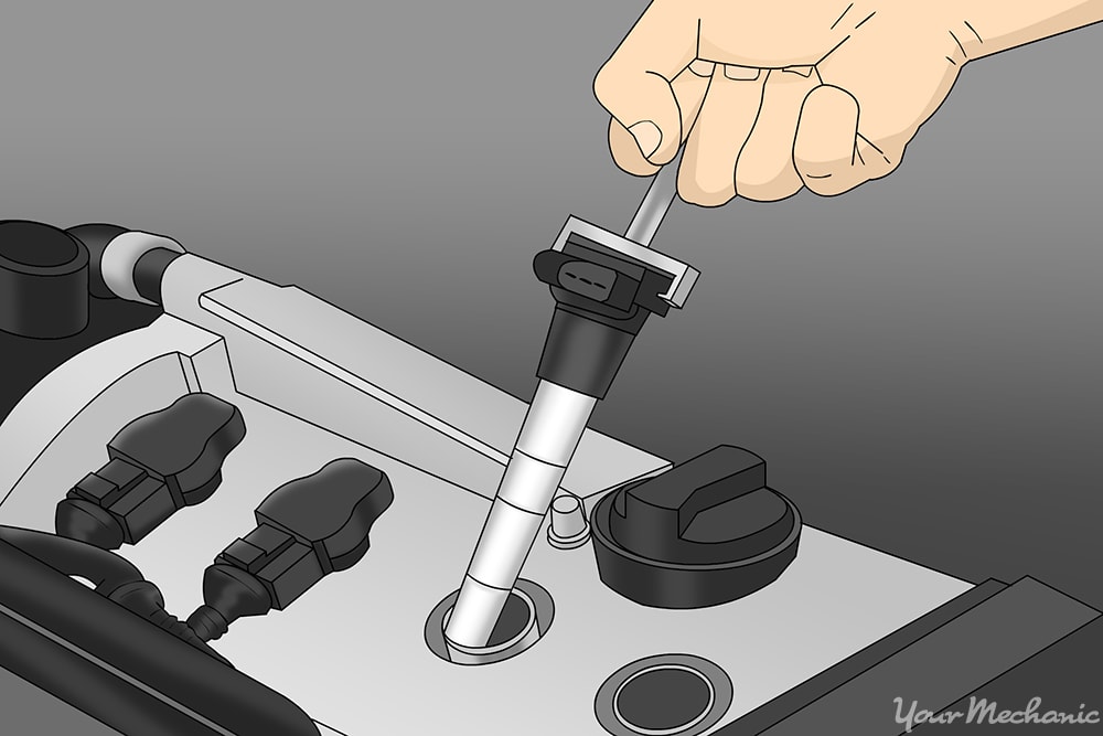 hand removing the ignition coils