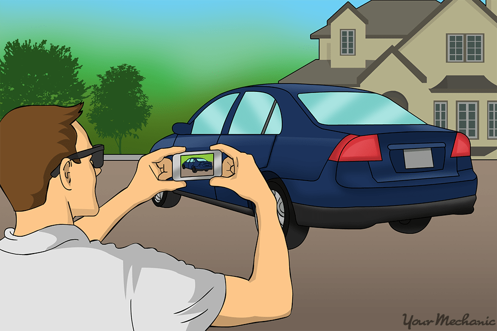 person taking pictures of car before it