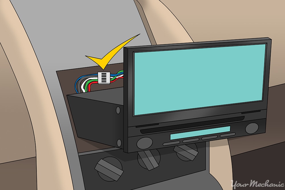 showing conversion wiring harness being connected to back of the player