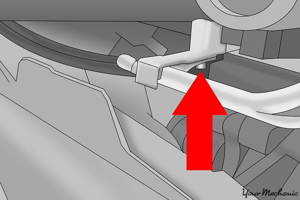 oil cooler line bracket mounted to side of engine