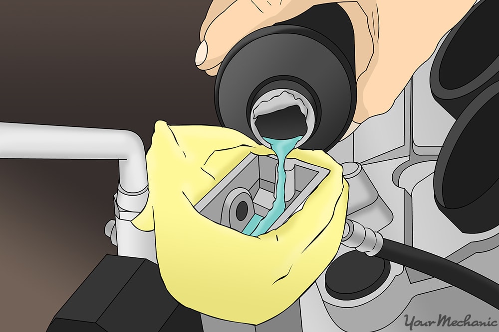 brake fluid being poured into the reservoir