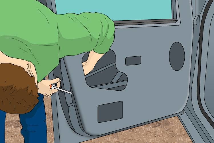 man reaching inside car door to remove the door latch