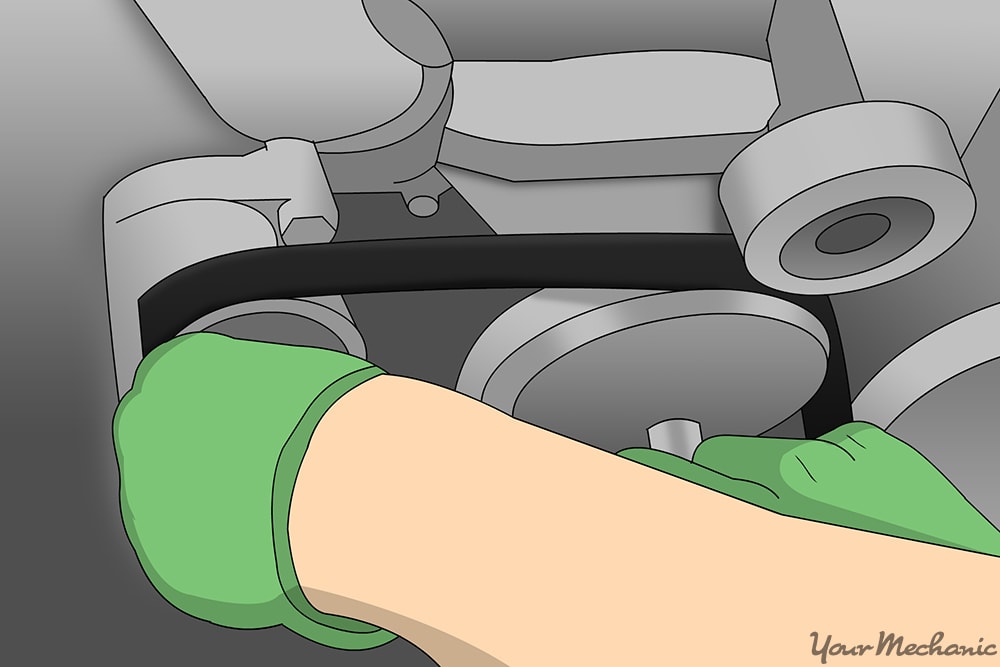 removing the serpentine belt and drive belt with glove on hand