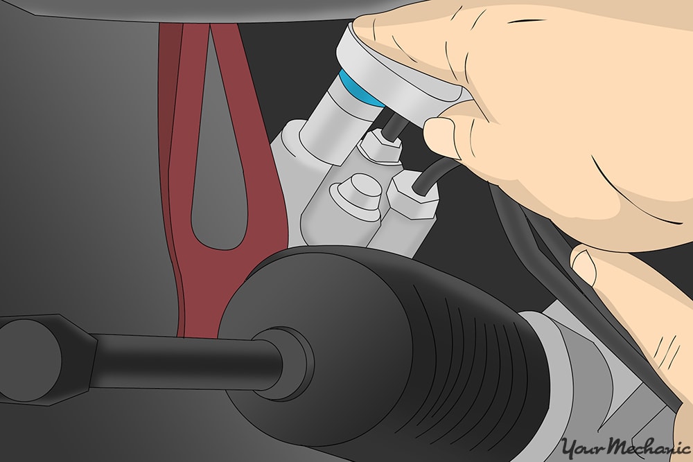 removing the power steering fluid lines located underneath the power steering pump