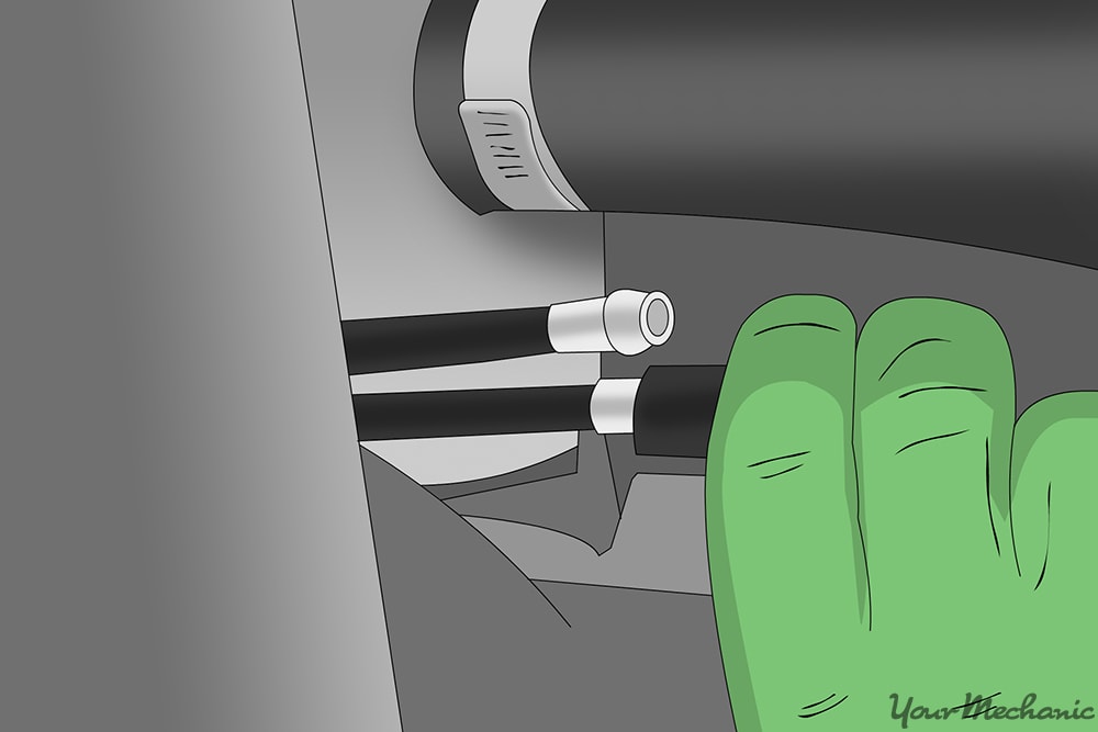 removing the ancillary lines connected to the power steering pump