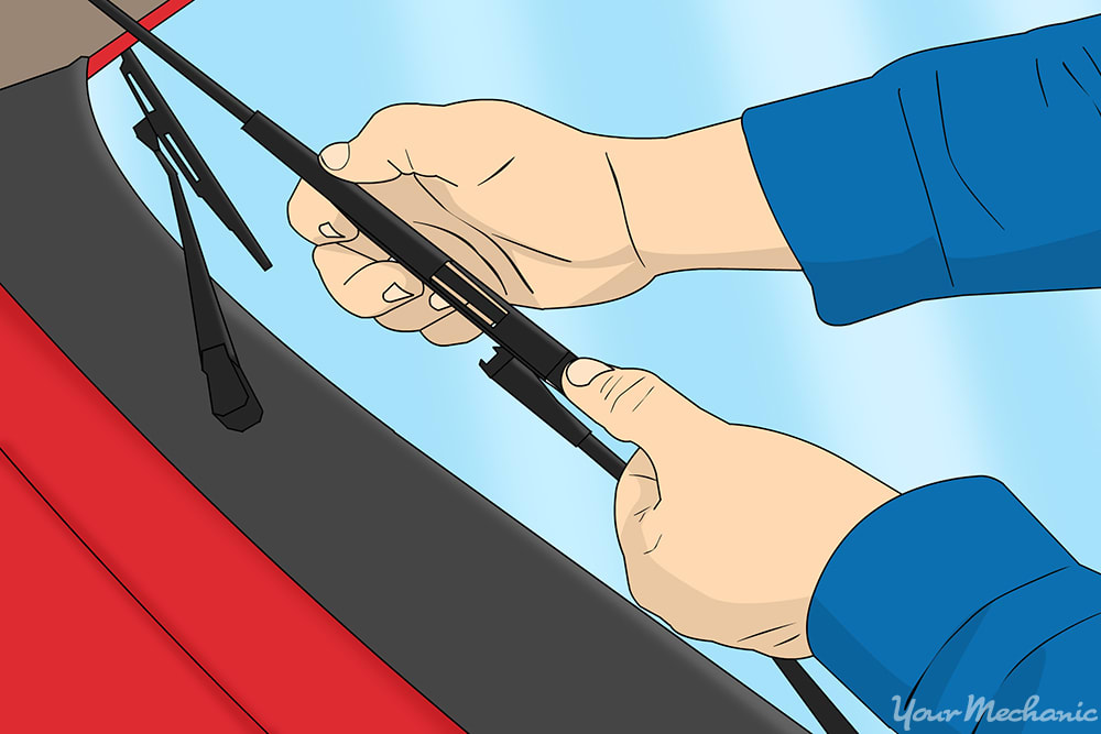 hands replacing wiper blades