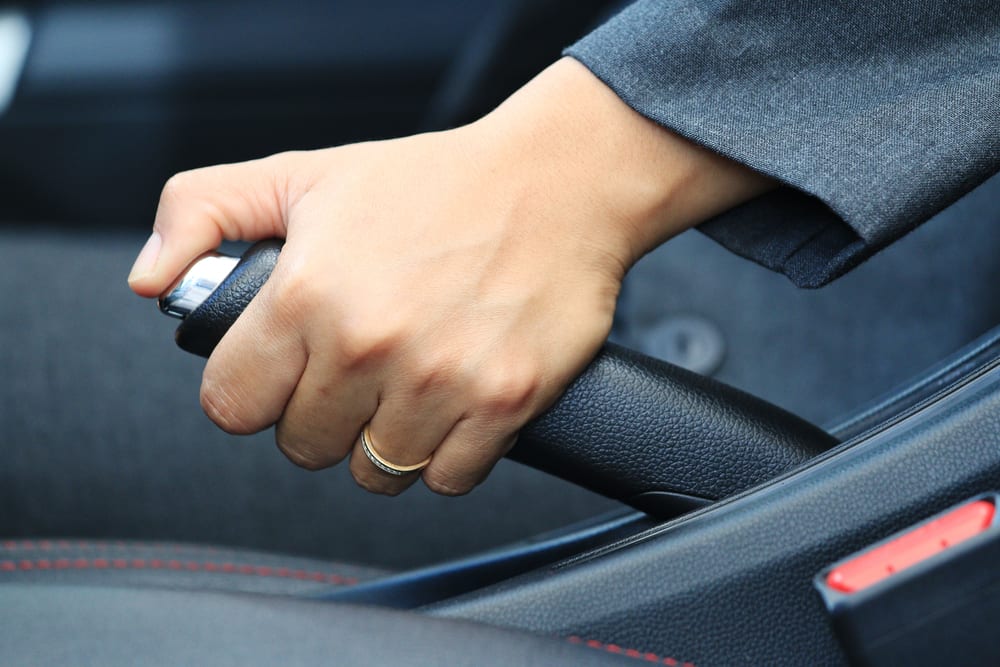 What Happens When You Drive With the Parking Brake On? | YourMechanic Advice