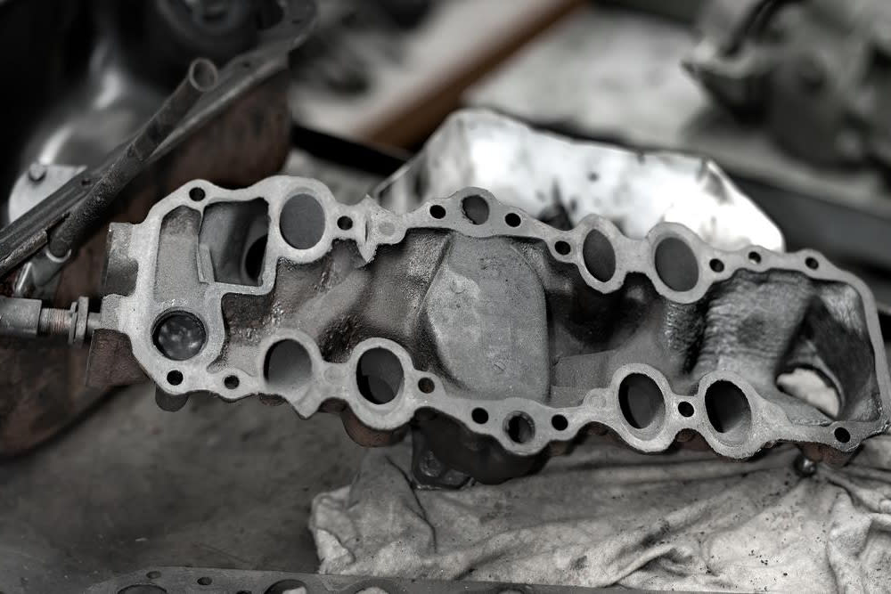 Replace exhaust outlet manifold