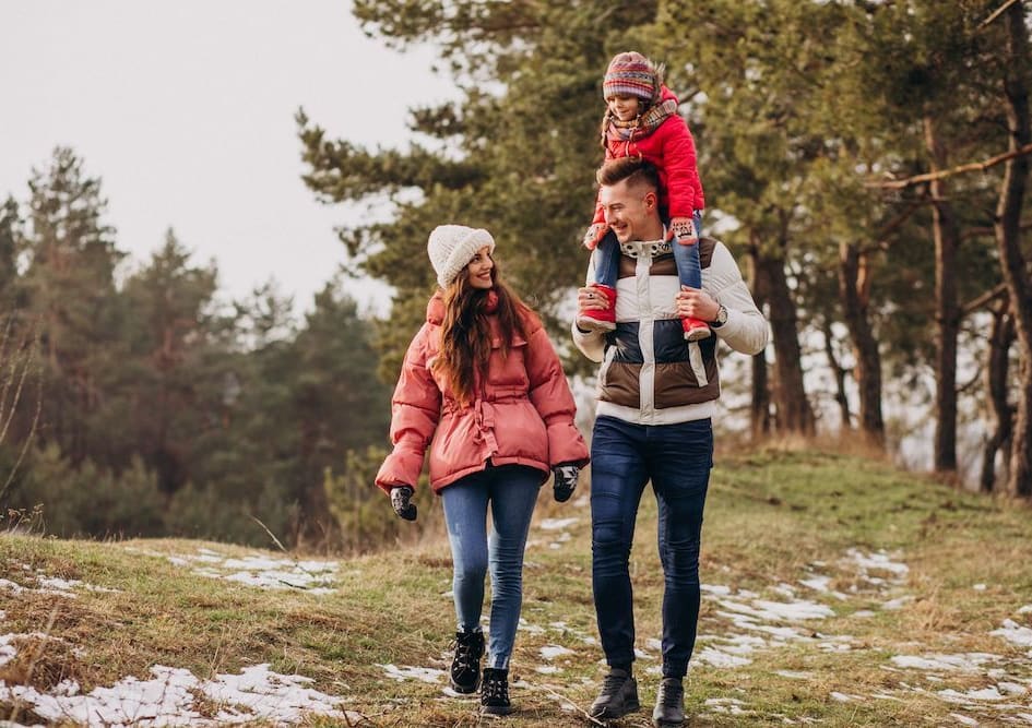 young-family-together-walking-forest-winter-time (1).jpg