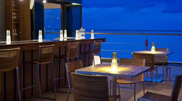 62m charter yacht Aqua Mekong - dining on deck at night