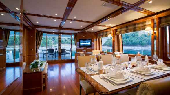 Rebecca V, 25.8m charter yacht - main saloon dining table