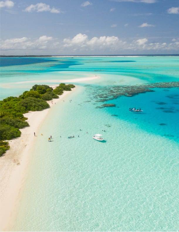 Aerial view of sandy beach and turquoise water