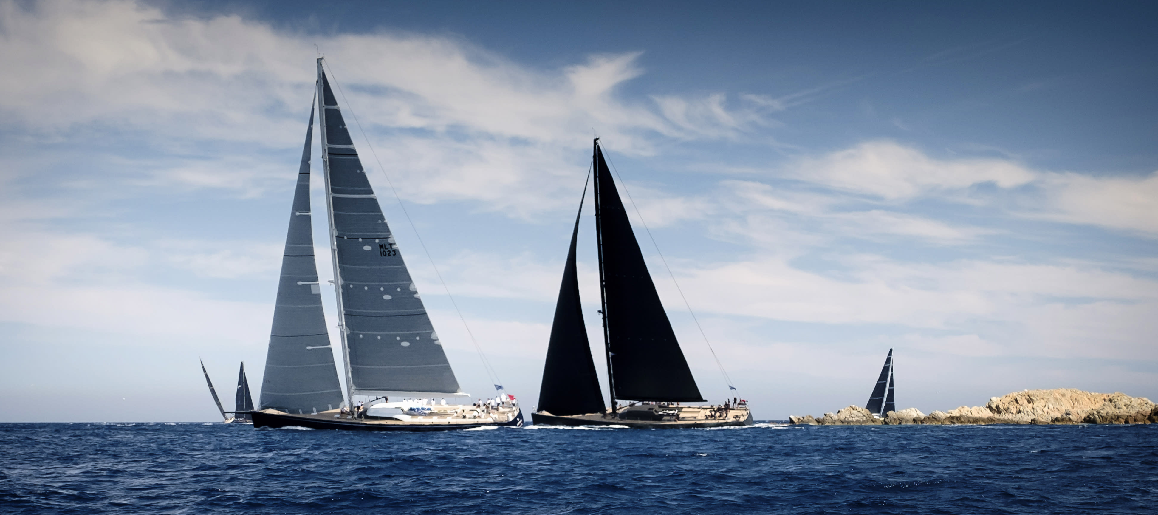 Sailing yachts sailing in a superyacht regatta