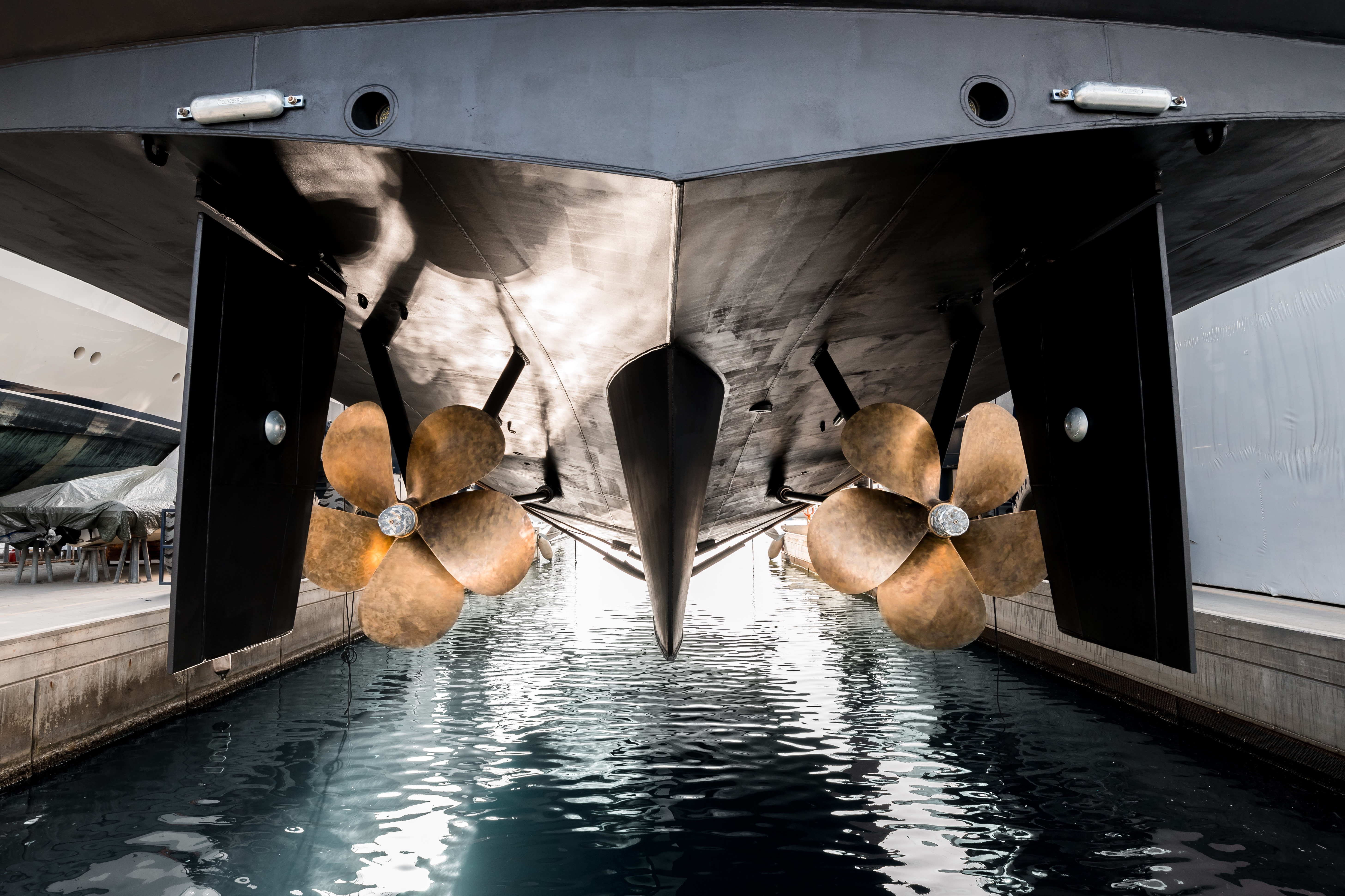 Propellers on the hull of a yacht in the shipyard