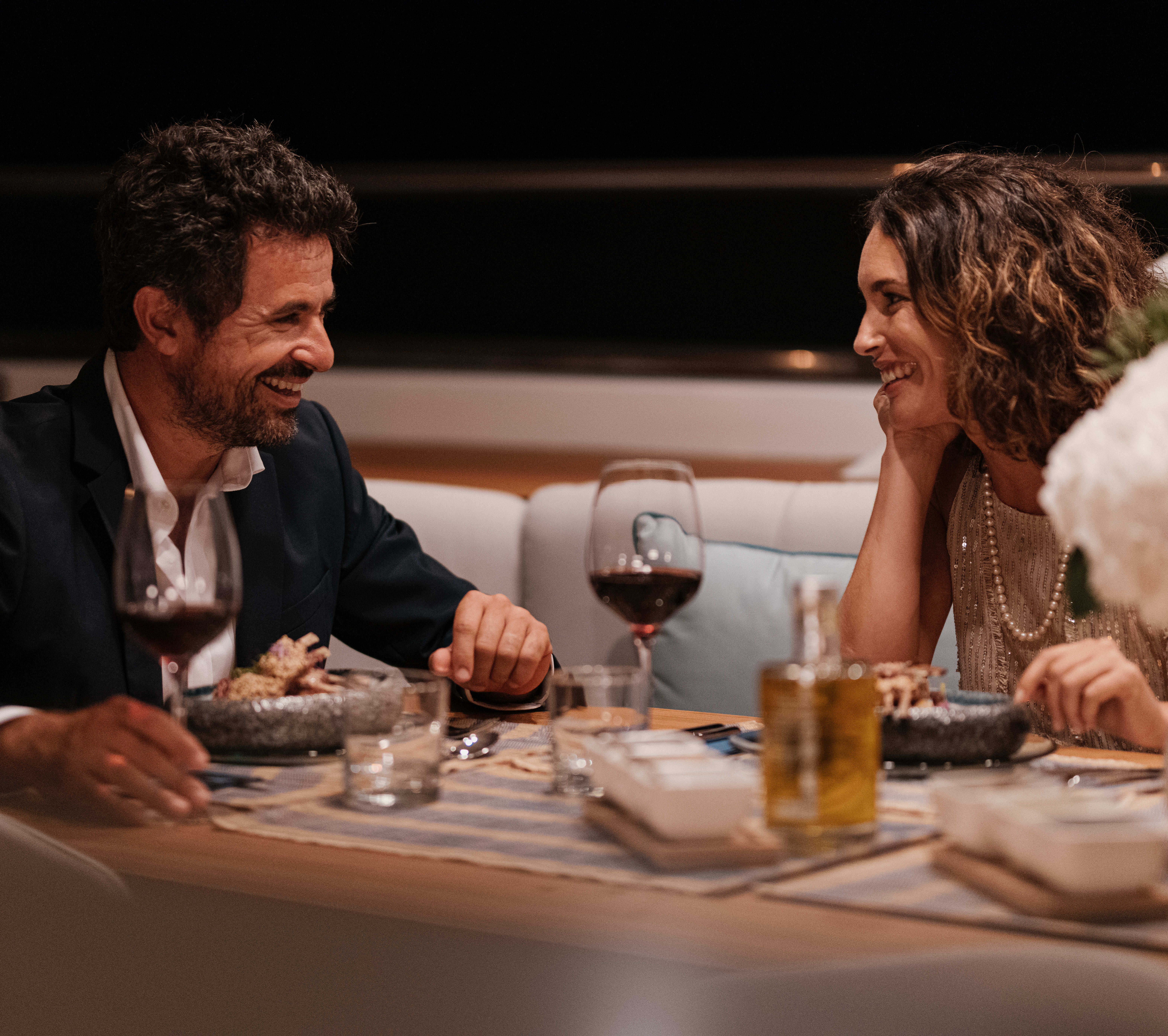 Couple enjoying dinner onboard a superyacht