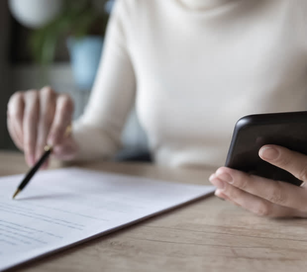 Person doing paperwork at a desk