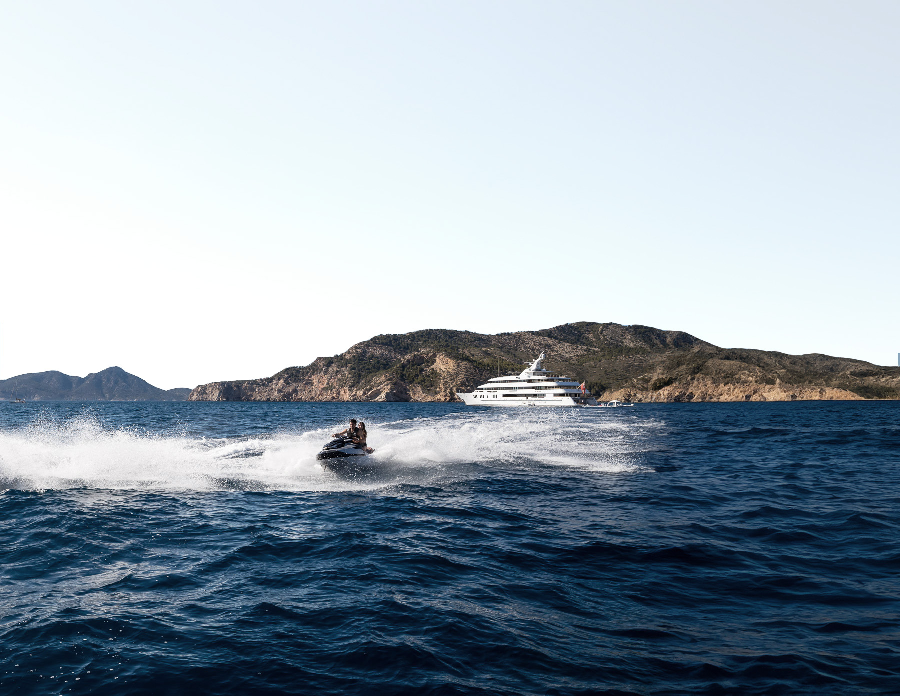 Yacht in deep turquoise waters