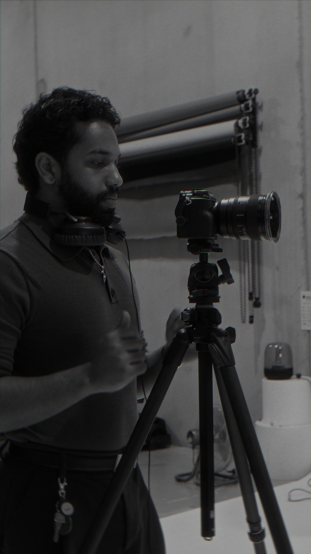 Film director and producer reviewing footage at video village monitor station