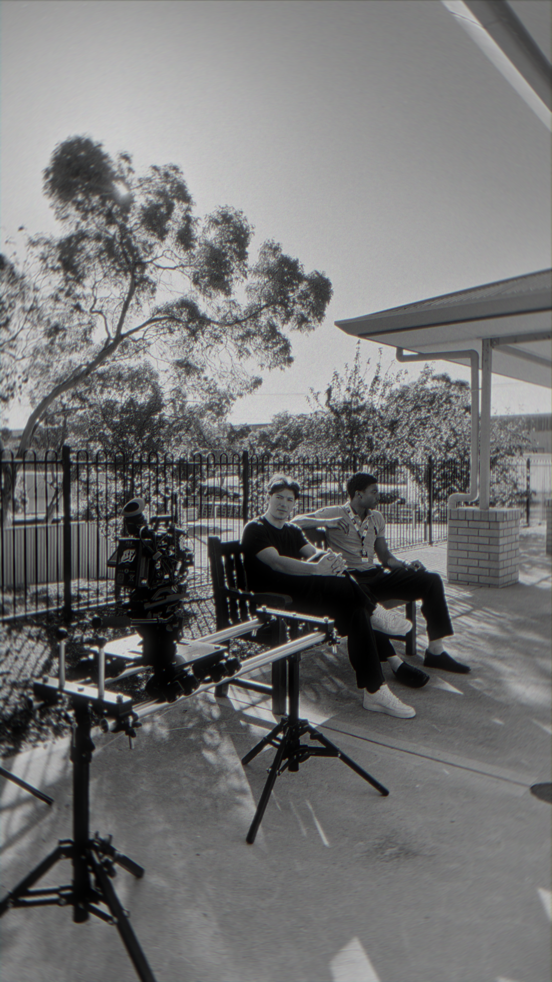 Director and camera monitor filming actress in studio