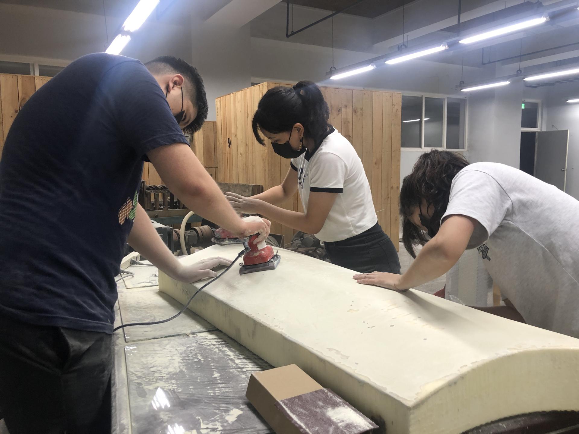 Polishing the bodywork mold.